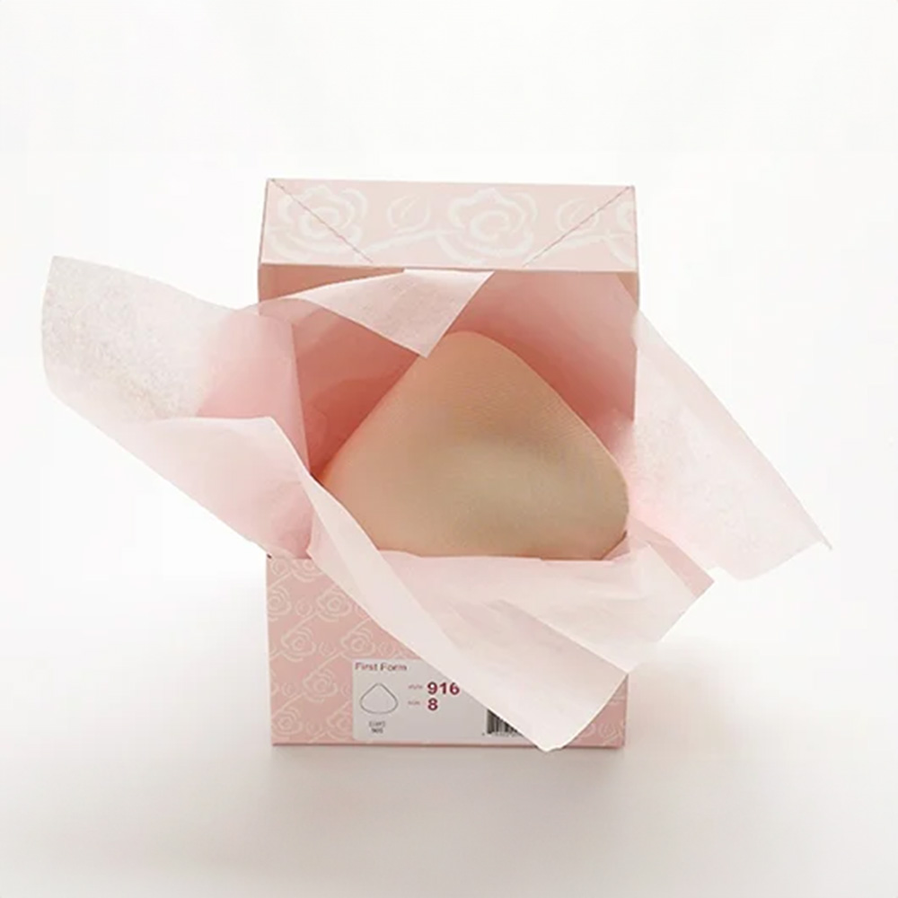 Breastforms stored in their original packaging.